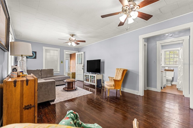 1405 NE 55th St, Ocala, FL 34479 - living room featuring ceiling fan, wood-type flooring, and baseboards