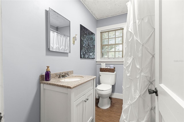 1405 NE 55th St, Ocala, FL 34479 - full bath with wood finished floors, toilet, vanity, and baseboards