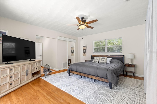 2475 SW 7th Ave, Ocala, FL 34471 - bedroom featuring light wood-style floors, a closet, and baseboards