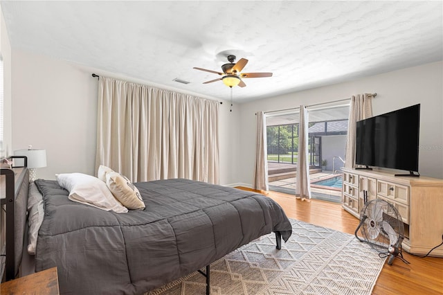 2475 SW 7th Ave, Ocala, FL 34471 - bedroom with access to outside, light wood-type flooring, and a ceiling fan