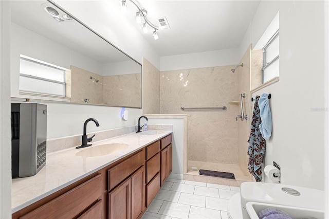 2475 SW 7th Ave, Ocala, FL 34471 - bathroom featuring healthy amount of natural light, tiled shower, and double vanity
