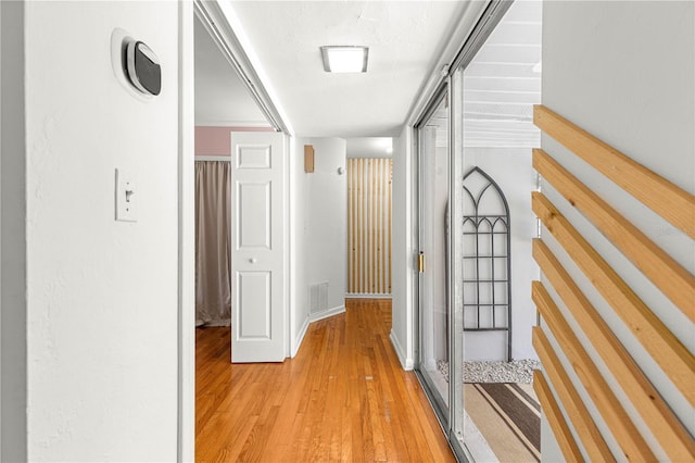 2475 SW 7th Ave, Ocala, FL 34471 - hallway with light wood-style floors, baseboards, and stairs