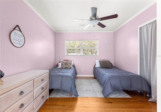 2475 SW 7th Ave, Ocala, FL 34471 - bedroom featuring wood finished floors, crown molding, baseboards, and ceiling fan