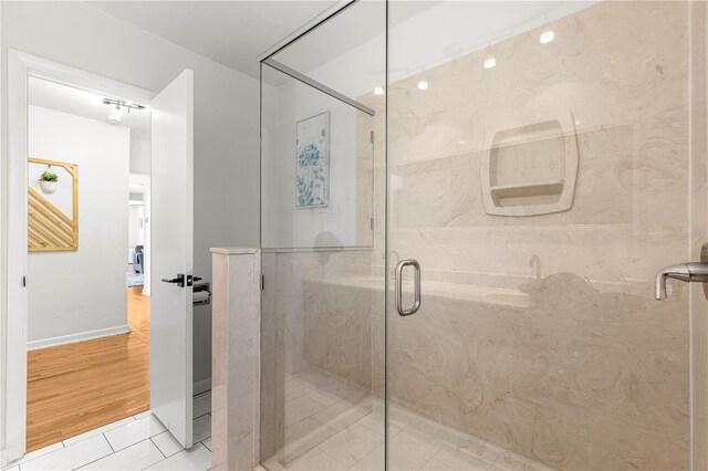 2475 SW 7th Ave, Ocala, FL 34471 - bathroom with a marble finish shower and tile patterned floors