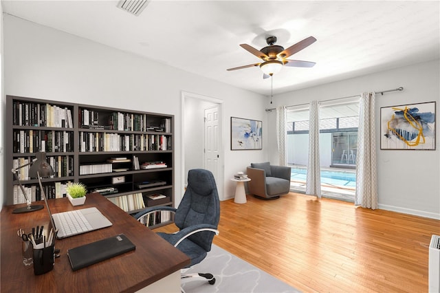 2475 SW 7th Ave, Ocala, FL 34471 - office space featuring a ceiling fan, wood finished floors, and baseboards