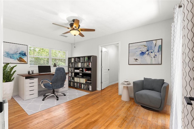 2475 SW 7th Ave, Ocala, FL 34471 - home office with hardwood / wood-style floors, a ceiling fan, and baseboards