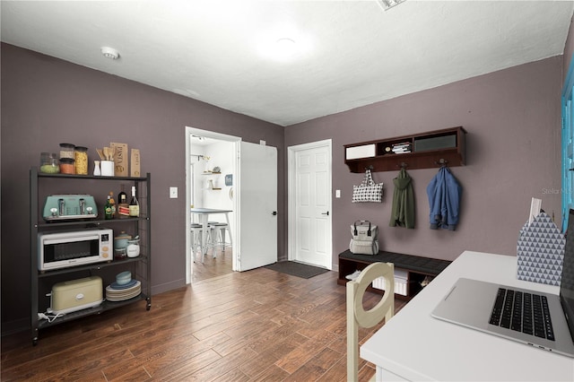 2475 SW 7th Ave, Ocala, FL 34471 - kitchen featuring dark wood-style floors, white microwave, and baseboards