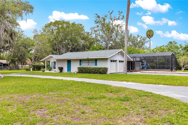 2475 SW 7th Ave, Ocala, FL 34471 - view of front of home with an attached garage, stucco siding, driveway, and a carport