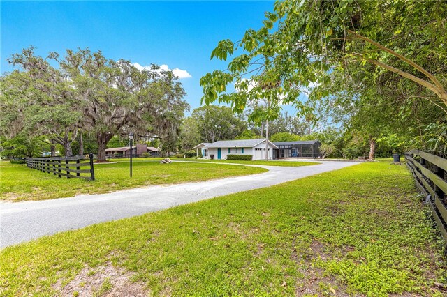2475 SW 7th Ave, Ocala, FL 34471 - ranch-style house with driveway and a carport