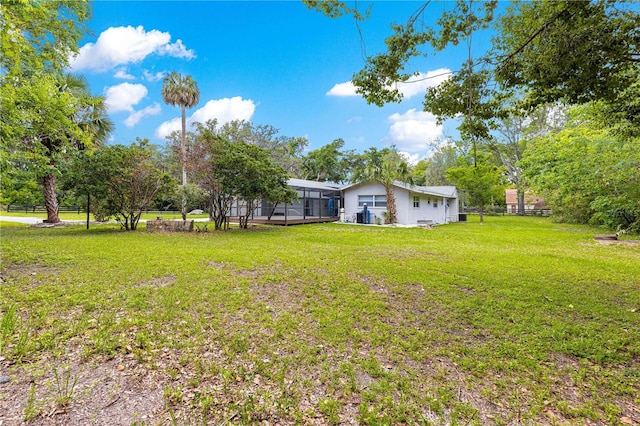 2475 SW 7th Ave, Ocala, FL 34471 - view of yard with a sunroom and view of wooded area
