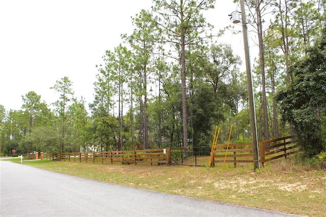 5306 W Comstock Pl, Beverly Hills, FL 34465 - view of asphalt road with traffic signs