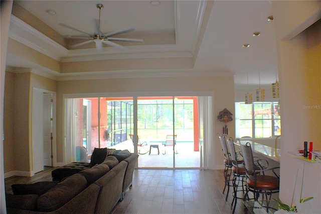 5306 W Comstock Pl, Beverly Hills, FL 34465 - living room featuring a tray ceiling, ceiling fan, crown molding, and wood finished floors