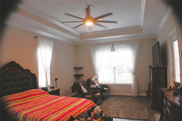 5306 W Comstock Pl, Beverly Hills, FL 34465 - bedroom with a raised ceiling, multiple windows, crown molding, and a ceiling fan