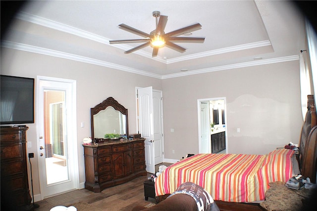 5306 W Comstock Pl, Beverly Hills, FL 34465 - bedroom with wood finished floors, a tray ceiling, ornamental molding, baseboards, and ensuite bath