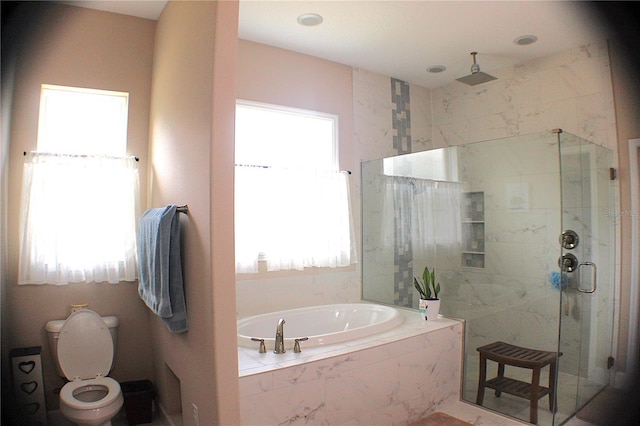 5306 W Comstock Pl, Beverly Hills, FL 34465 - bathroom with toilet, a stall shower, a garden tub, and plenty of natural light