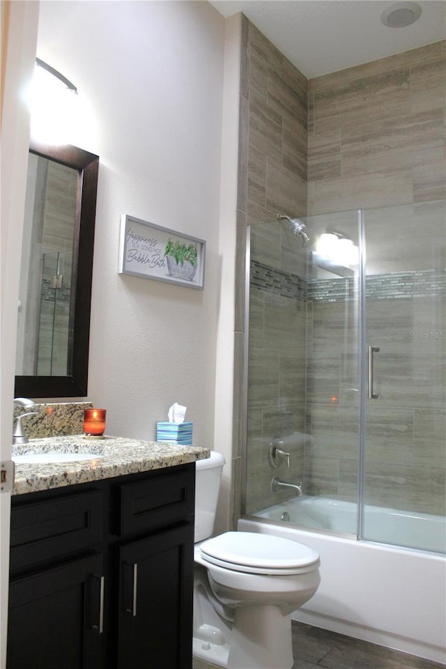 5306 W Comstock Pl, Beverly Hills, FL 34465 - bathroom featuring toilet, vanity, and enclosed tub / shower combo