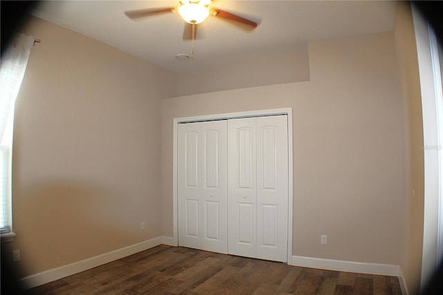 5306 W Comstock Pl, Beverly Hills, FL 34465 - unfurnished bedroom featuring wood finished floors, a closet, baseboards, and a ceiling fan