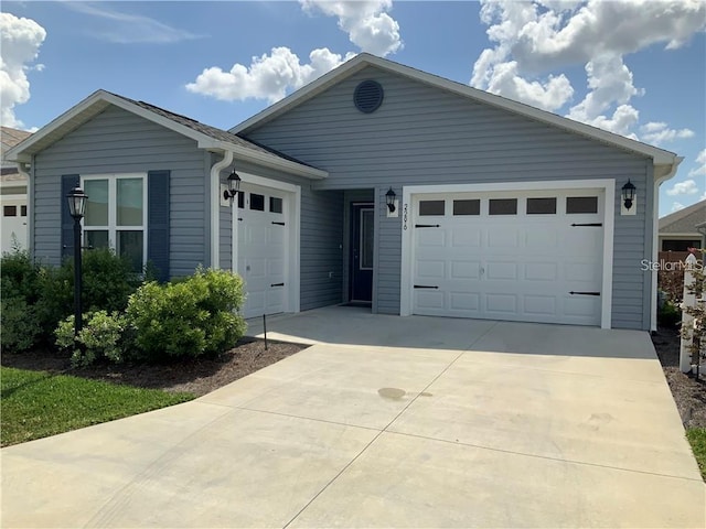 2296 Sheehan St, The Villages, FL 32163 - single story home featuring concrete driveway and an attached garage
