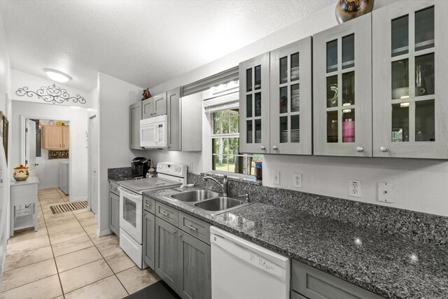 14131 SE 86th Ter, Inglis, FL 34449 - kitchen with white appliances, a sink, gray cabinetry, light tile patterned floors, and a textured ceiling