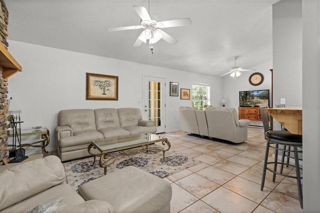 14131 SE 86th Ter, Inglis, FL 34449 - living room featuring lofted ceiling, ceiling fan, and light tile patterned floors