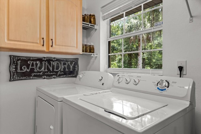 14131 SE 86th Ter, Inglis, FL 34449 - laundry room featuring washer and dryer and cabinet space