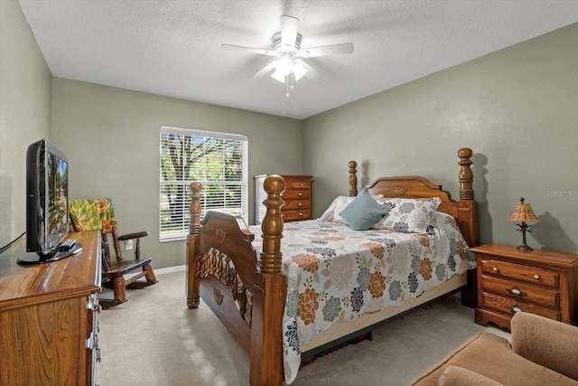 14131 SE 86th Ter, Inglis, FL 34449 - bedroom with carpet floors, a textured ceiling, ceiling fan, and baseboards