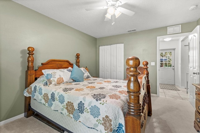 14131 SE 86th Ter, Inglis, FL 34449 - bedroom with a closet, baseboards, light colored carpet, and ceiling fan