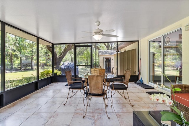 14131 SE 86th Ter, Inglis, FL 34449 - sunroom with a ceiling fan, outdoor dining space, and healthy amount of natural light
