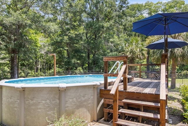 14131 SE 86th Ter, Inglis, FL 34449 - swimming pool featuring view of wooded area