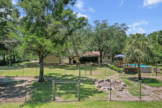 14131 SE 86th Ter, Inglis, FL 34449 - surrounding community featuring a gate and a swimming pool