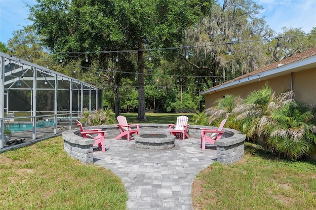 12495 SW 66th St, Ocala, FL 34481 - view of green lawn featuring a fire pit, an outdoor pool, a patio area, and a lanai