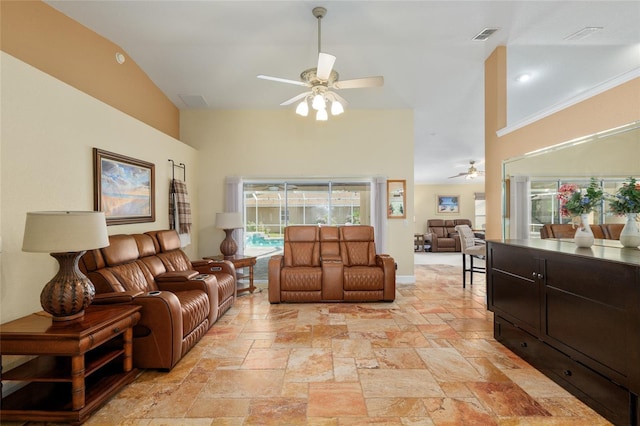 12495 SW 66th St, Ocala, FL 34481 - living area featuring a ceiling fan, stone tile floors, and a high ceiling