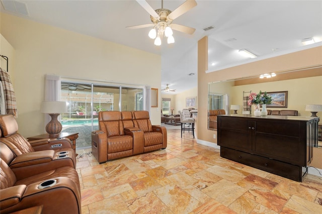 12495 SW 66th St, Ocala, FL 34481 - living area with ceiling fan, stone tile flooring, and high vaulted ceiling
