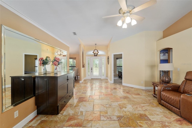 12495 SW 66th St, Ocala, FL 34481 - entrance foyer with baseboards, stone tile floors, and ceiling fan