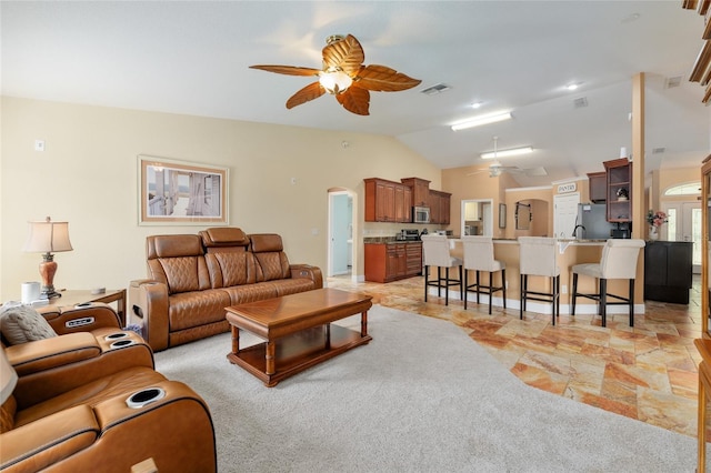 12495 SW 66th St, Ocala, FL 34481 - living area with ceiling fan, vaulted ceiling, and arched walkways