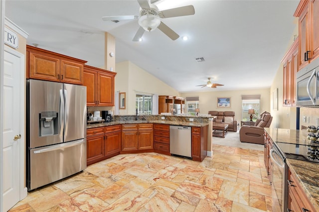 12495 SW 66th St, Ocala, FL 34481 - kitchen featuring appliances with stainless steel finishes, ceiling fan, healthy amount of natural light, a peninsula, and vaulted ceiling