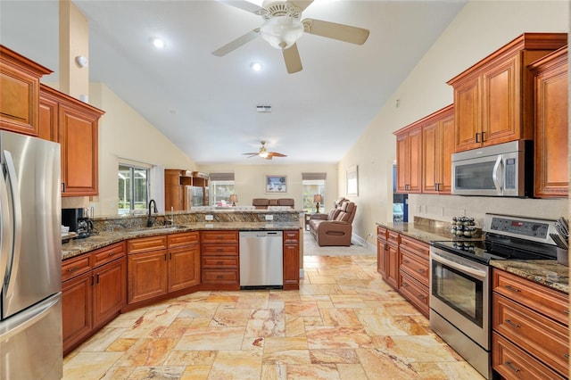12495 SW 66th St, Ocala, FL 34481 - kitchen featuring appliances with stainless steel finishes, open floor plan, lofted ceiling, a sink, and a ceiling fan