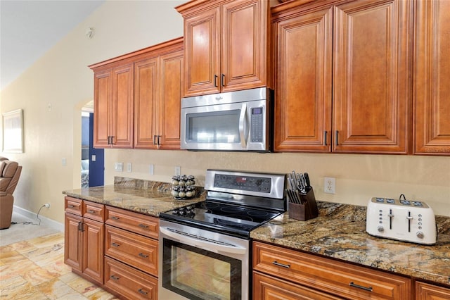 12495 SW 66th St, Ocala, FL 34481 - kitchen featuring appliances with stainless steel finishes and brown cabinets