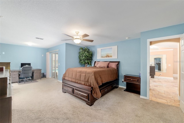 12495 SW 66th St, Ocala, FL 34481 - bedroom with carpet flooring, a desk, arched walkways, a ceiling fan, and baseboards