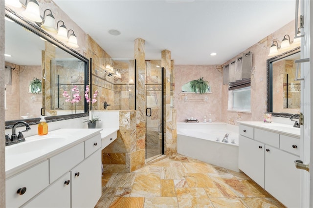 12495 SW 66th St, Ocala, FL 34481 - bathroom featuring two vanities, a garden tub, a stall shower, marble finish flooring, and recessed lighting
