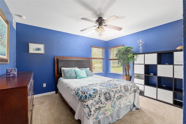 12495 SW 66th St, Ocala, FL 34481 - carpeted bedroom featuring a textured wall, baseboards, and ceiling fan