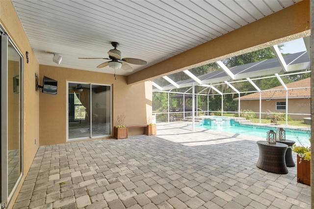 12495 SW 66th St, Ocala, FL 34481 - view of pool featuring a patio area, a pool with connected hot tub, a ceiling fan, and glass enclosure