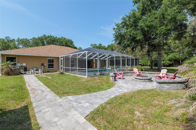 12495 SW 66th St, Ocala, FL 34481 - rear view of property featuring an outdoor fire pit, a patio area, an outdoor pool, a lawn, and glass enclosure