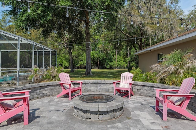 12495 SW 66th St, Ocala, FL 34481 - view of patio / terrace with an outdoor fire pit, glass enclosure, and view of wooded area