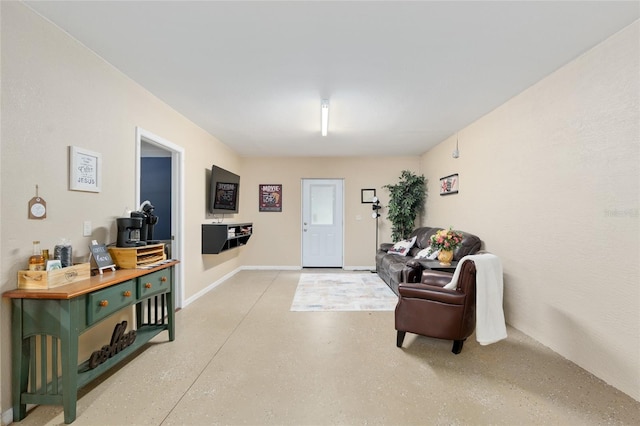 12495 SW 66th St, Ocala, FL 34481 - foyer featuring finished concrete floors and baseboards