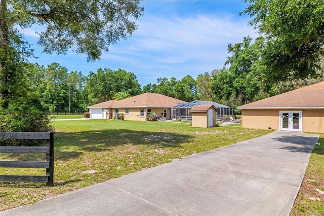 12495 SW 66th St, Ocala, FL 34481 - view of yard with french doors and driveway