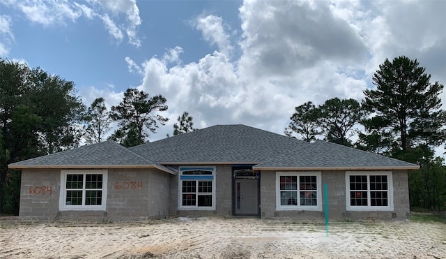 6084 N Orchis Ter, Beverly Hills, FL 34465 - view of front facade featuring roof with shingles and concrete block siding
