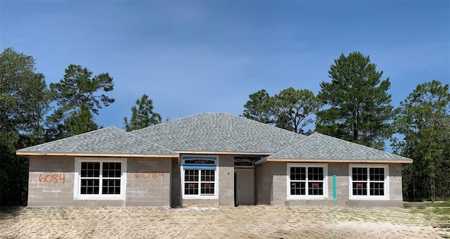6084 N Orchis Ter, Beverly Hills, FL 34465 - property under construction featuring a shingled roof and concrete block siding
