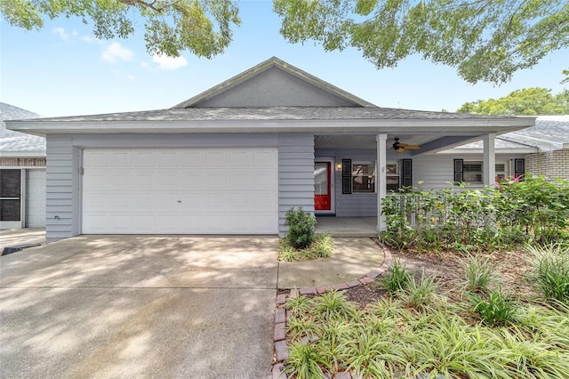 8745 SW 92nd St Unit B, Ocala, FL 34481 - view of front facade with ceiling fan, concrete driveway, a garage, and covered porch