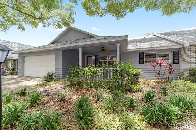 8745 SW 92nd St Unit B, Ocala, FL 34481 - view of front of home with a garage, covered porch, ceiling fan, driveway, and roof with shingles